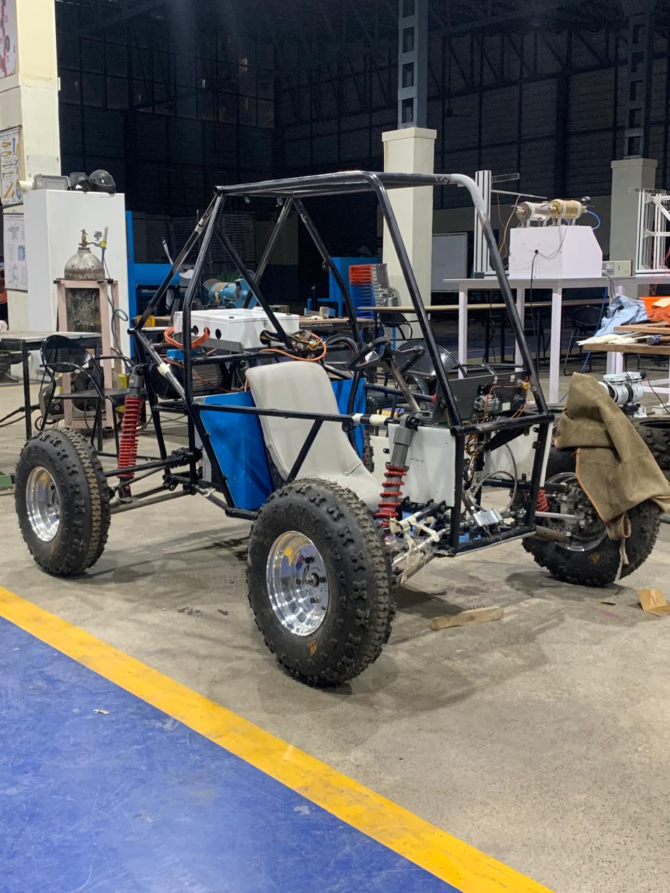 Team Avinya electric ATV vehicle assembly process in workshop